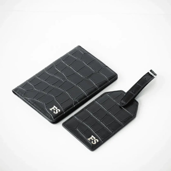 Black personalised leather passport holder and luggage tag customisable with your name perfect for travel and gifting